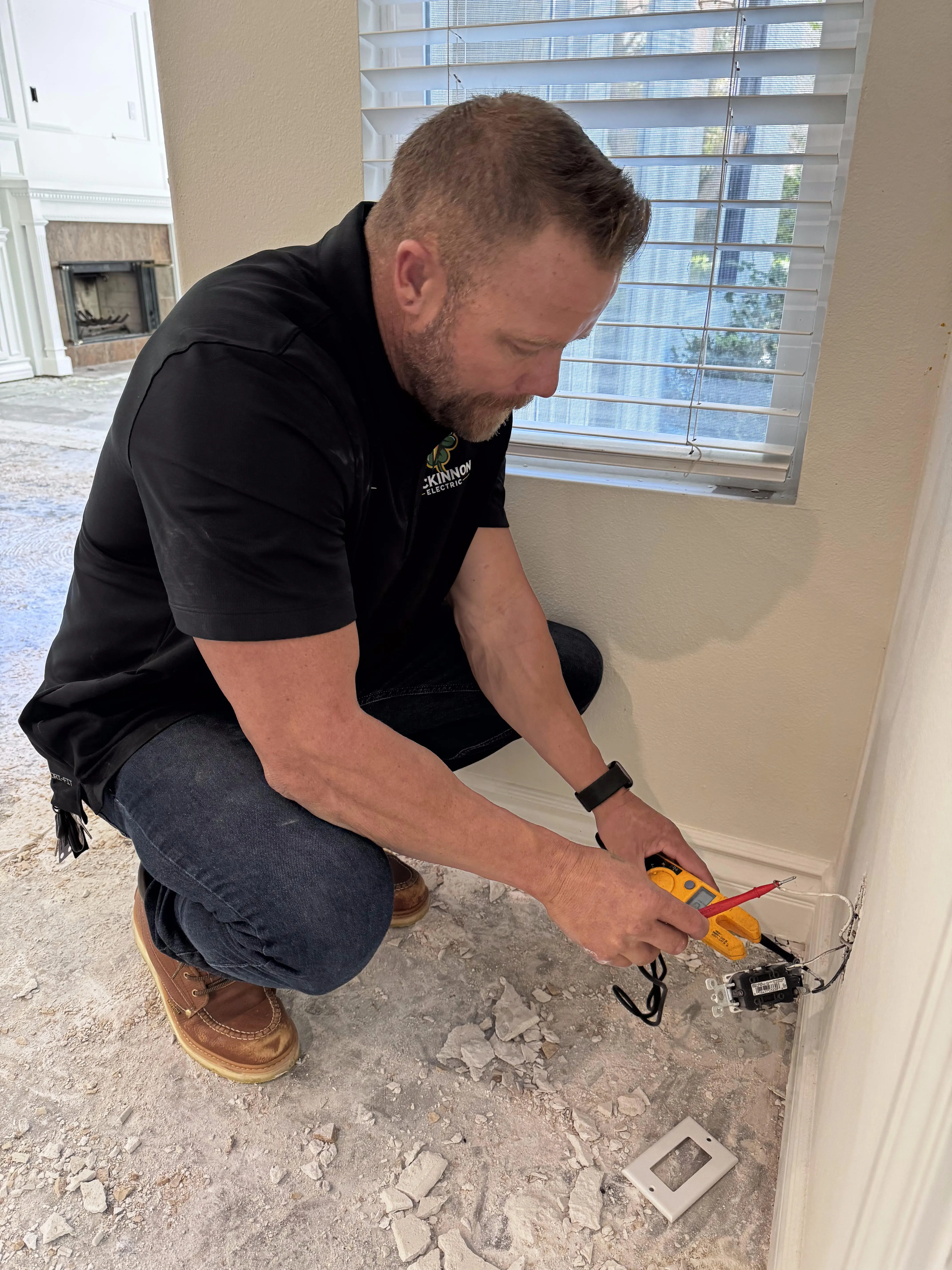 McKinnon Electric working on outlets